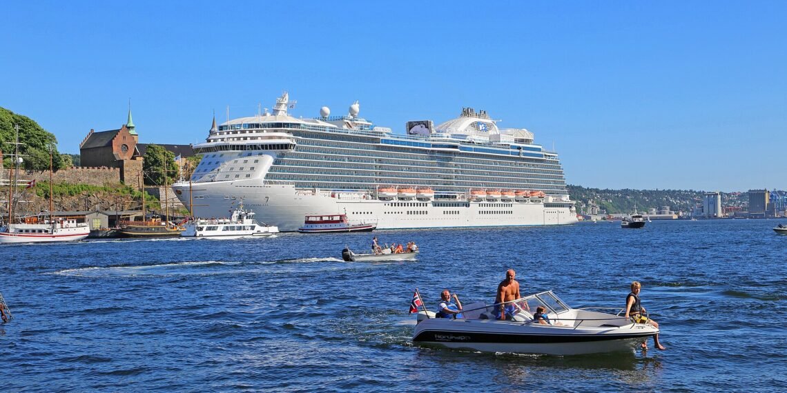 Cruise ship in Oslo harbour beside Akershus Fortress