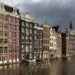 Canal houses on the Damrak in Amsterdam