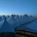Denver International Airport main terminal with its peaked roof at dusk