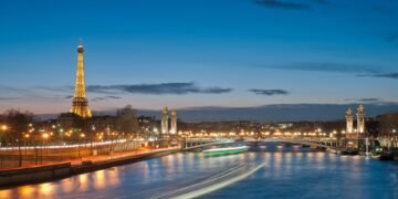 Eiffel Tower and Pont Alexandre III over the Seine in Paris at night