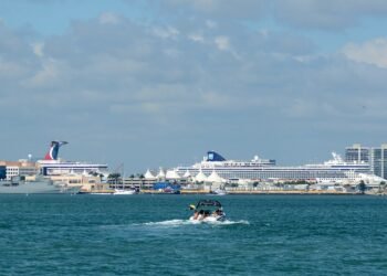 Cruise ships docked at the Port of Miami, seen across the water