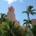 The pink Royal Hawaiian hotel framed by palm trees in Waikiki, Honolulu