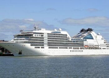 Seabourn Ovation cruise ship alongside a pier