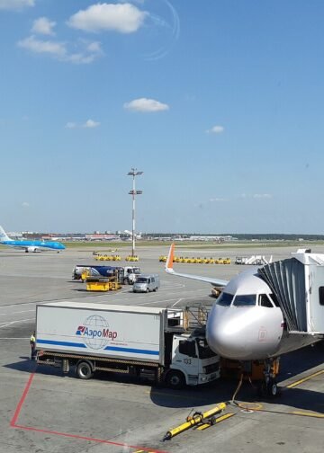 Aircraft at a gate on the apron at Moscow Sheremetyevo Airport, seen from Terminal D