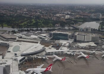 Aerial view of the international terminal at Sydney Kingsford Smith Airport with aircraft at the gates